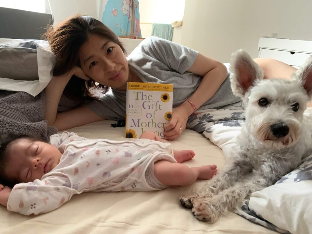 Yuri holding the Gift of Motherhood book